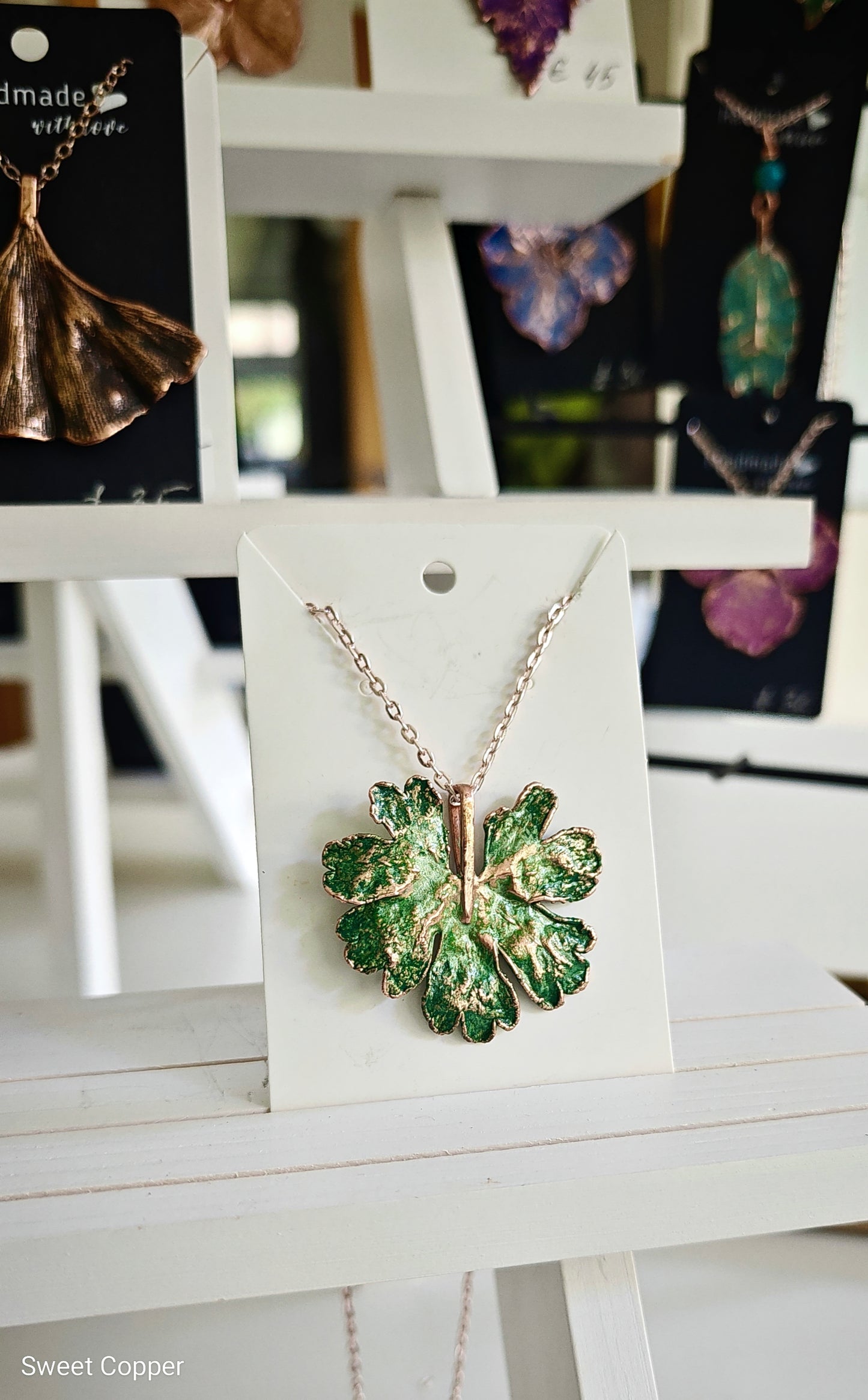 Copper Meadow Geranium Leaf Pendant. Green Patina.